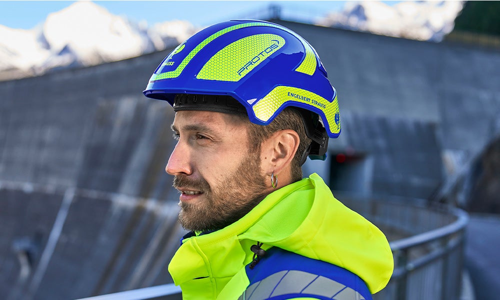 Casco da lavoro abbinato alla collezione, in blu reale/arancio fluo
